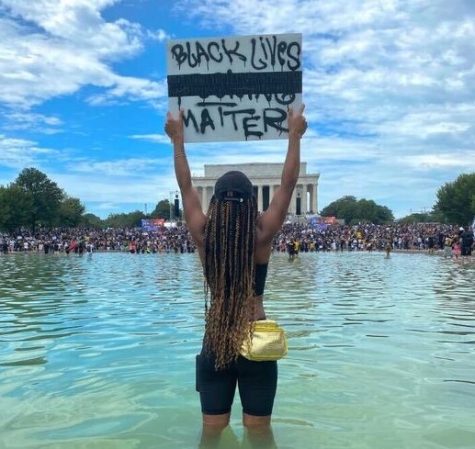 From Instagram user @venturewithv, boldly standing her ground amidst thousands at a Black Lives Matter protest.