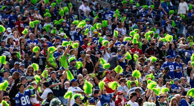 (After the loss of the Seattle Seahawks, fans continue to cheer on the Seattle Seahawks with green poms during week 1 vs the 49ers. This game took place at Lumen field, where the Seahawks play, ending score is 49ers 17 vs. Seahawks 13. Photo by Rod Mar/Seattle Seahawks)

